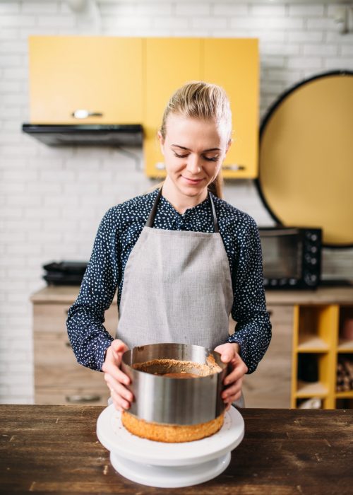 woman-cook-in-apron-takes-the-form-of-a-baked-cake.jpg